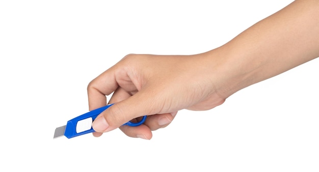 hand holding use stationery knife cutter isolated on a white background.