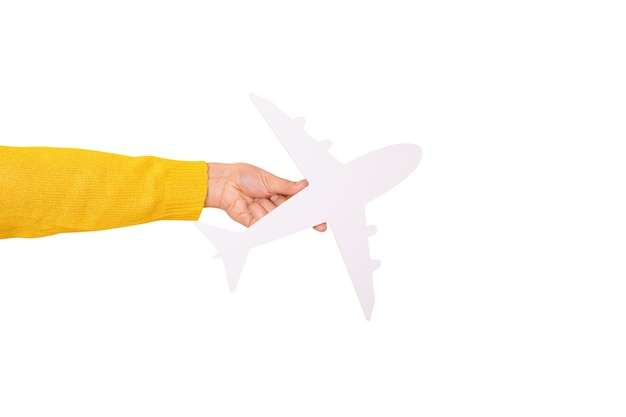 Photo hand holding white airplane isolated on white background