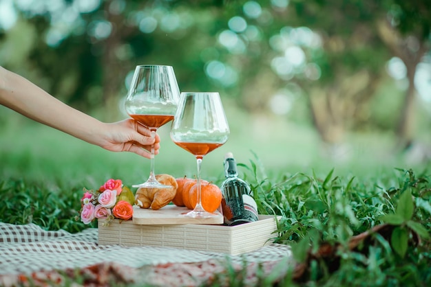 Hand holding wine glass on table