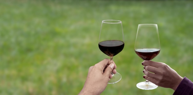 Hand holding wine glass