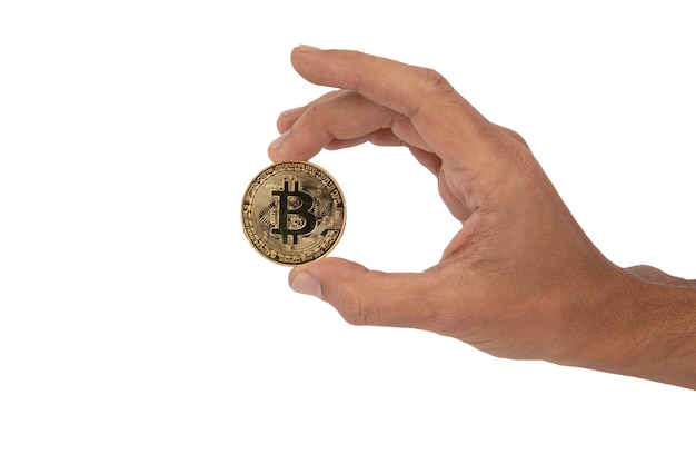 Hand holding with its fingers a golden bitcoin token