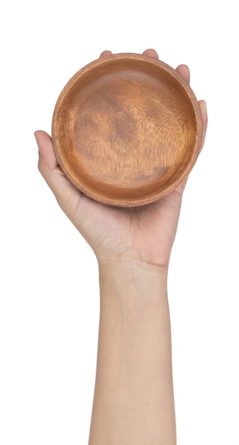 Hand holding Wooden bowl isolated on a white background