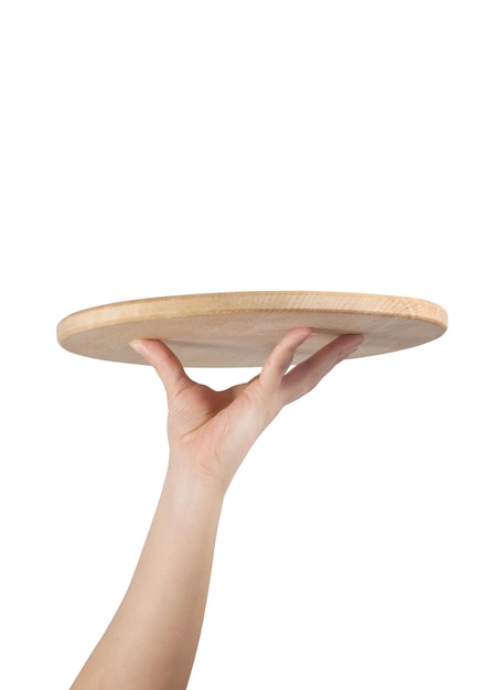 The hand holding a wooden tray