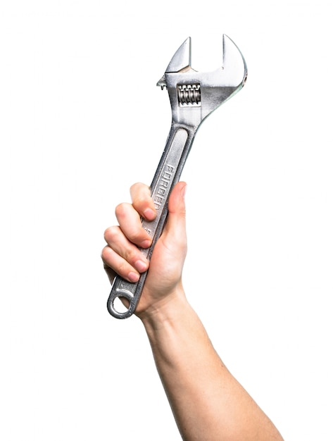 Hand holding Wrench over isolated white background