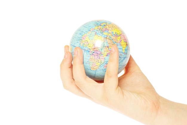 Hand holdings a globe on a white