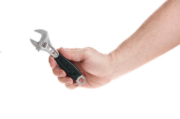 Photo hand holds an adjustable wrench on a white background, template for designers.