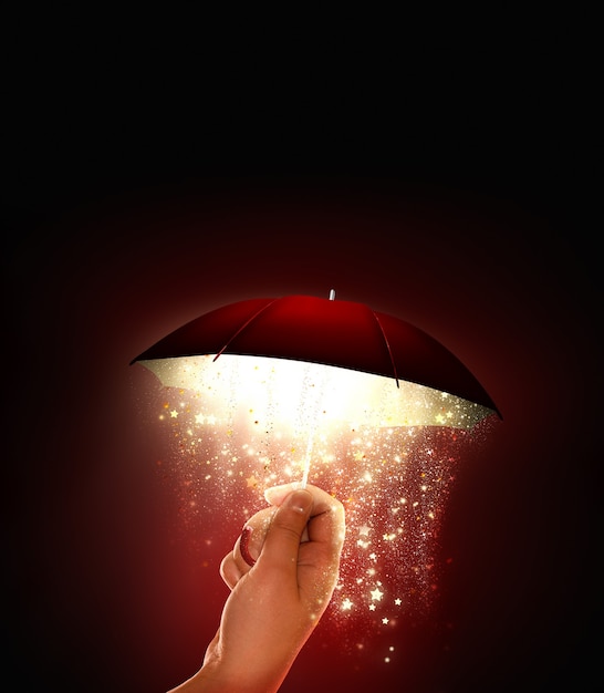 Hand holds a bright umbrella with a magical glow