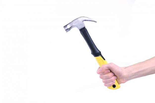 Hand holds hammer isolated