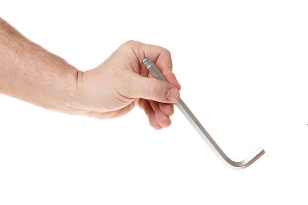 Hand holds a hex key on a white background a template for designers