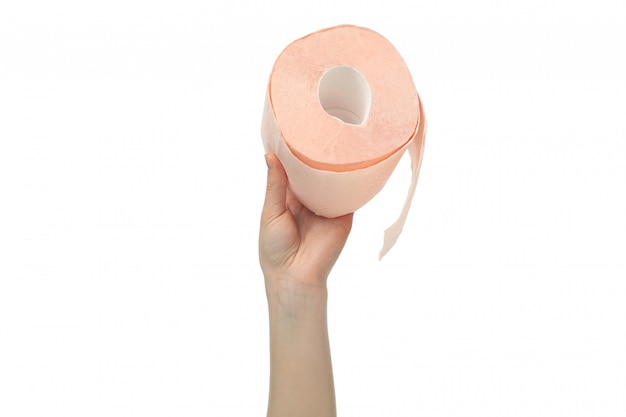 Hand holds toilet paper, isolated