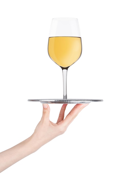 Hand holds tray with white wine glass on white