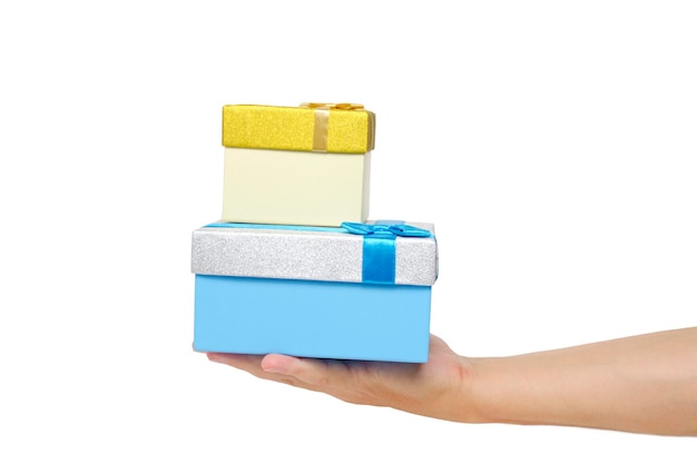 Hand holds two gift boxes on white background of isolate