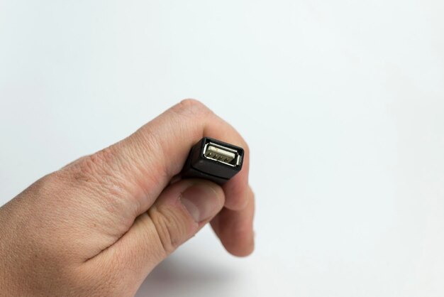 Hand holds usb cable
