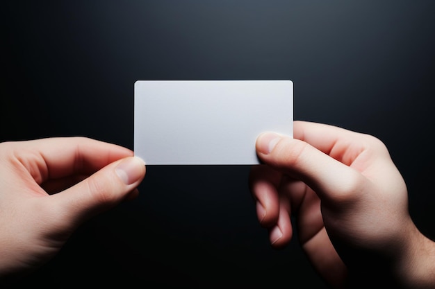 a hand holds a white card that says " blank " on it.