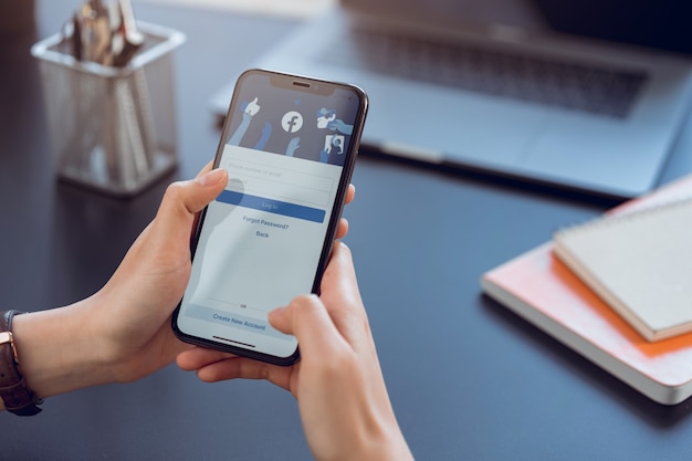 hand is holding smartphone and screen