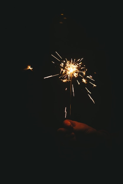 The hand of a lady holding a Bengali fire