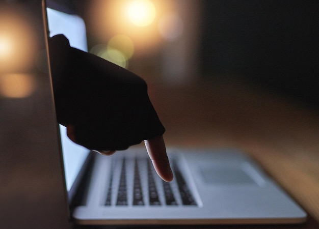 hand laptop and cybercrime with hacker screen and person with software data analysis computer closeup and pc with firewall system hacking programming and algorithm writing for malware and coding