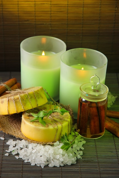 Hand made soap and candles on bamboo mat wall