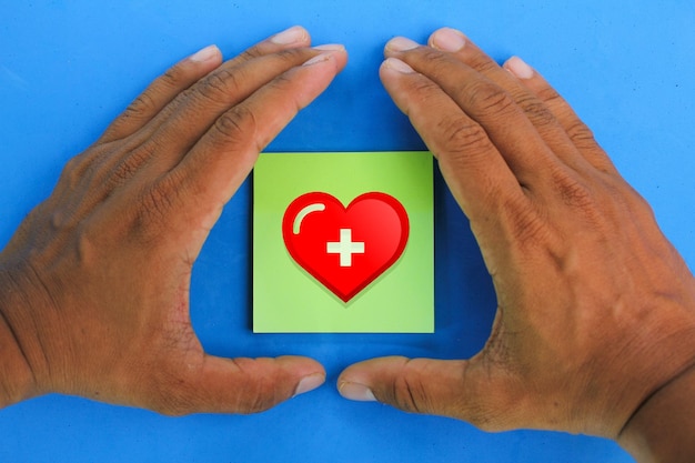 hand making protection on heart icon health care coverage concept medicare concept