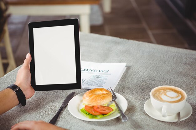 Hand of man holding digital tablet