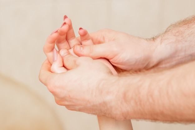 Hand massage of woman