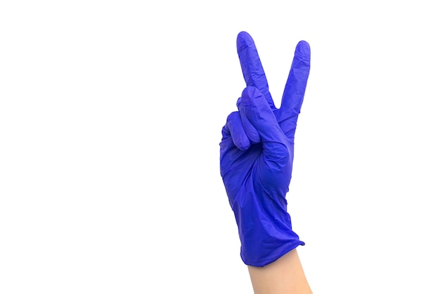 Hand in medical rubber glove victory sign gesture, isolated on a white background photo