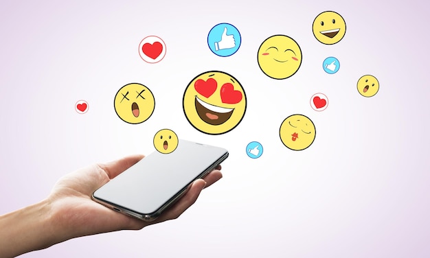 Hand met smartphone en smileys