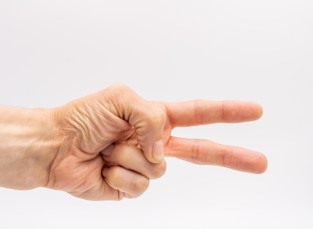 hand met twee vingers uit de mens op witte achtergrond in lichtbak