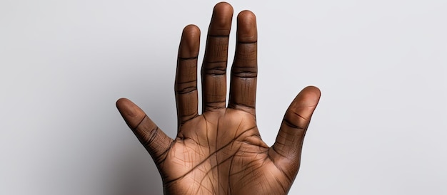 Hand of mixed race person holding black business card on white background
