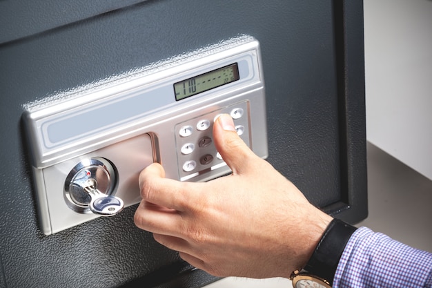 Hand opened a safe, close up