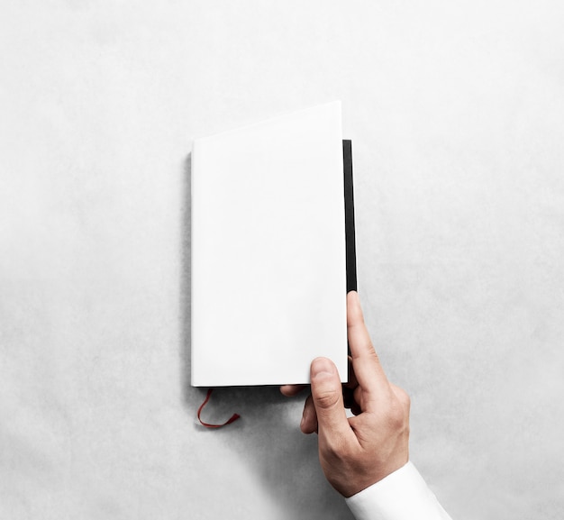 Hand opening blank white book cover mockup template