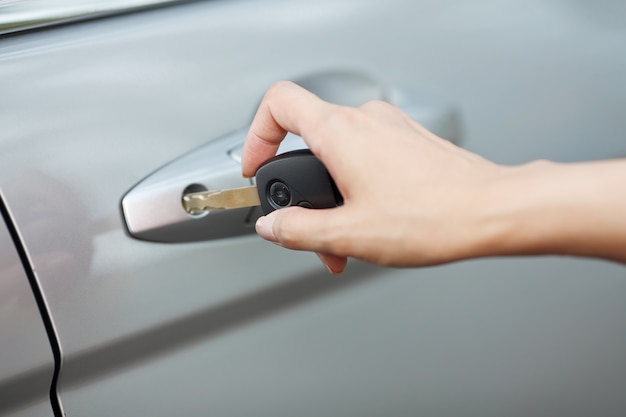 hand opening door of car.