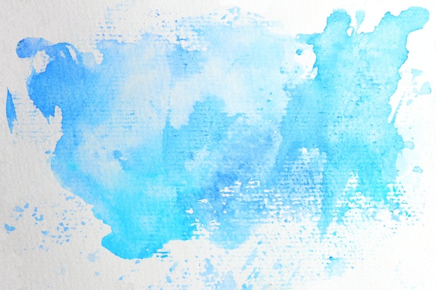 写真 白い紙に手描きの青い水彩抽象ステインペイントスプラッシュ背景