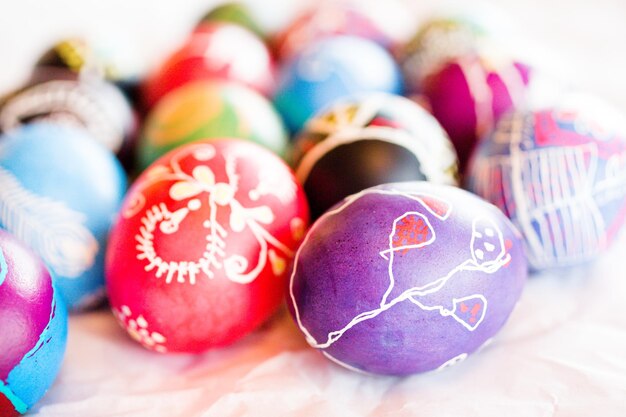 Hand painted Ukrainian Easter eggs decorated with folk designs using a wax resist method.