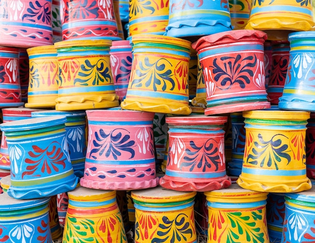 Photo hand painted vibrant color new clay pots for plants