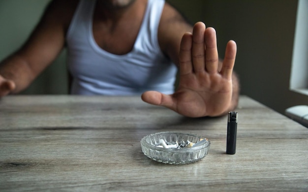 Hand of person refusing to cigarette