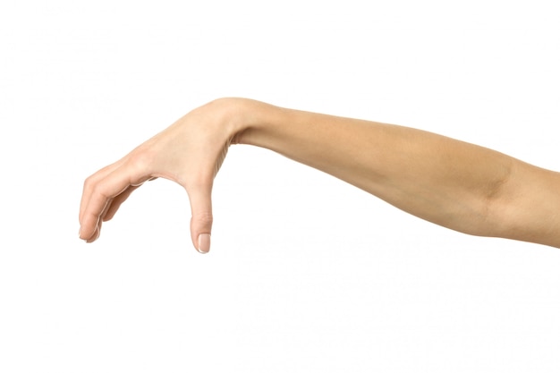 Hand picking, holding, grabbing or reaching. Woman hand gesturing isolated on white