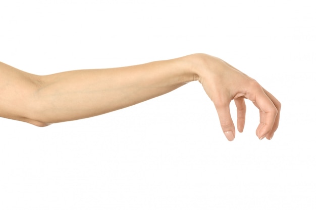 Hand picking, holding, grabbing or reaching. Woman hand gesturing isolated on white