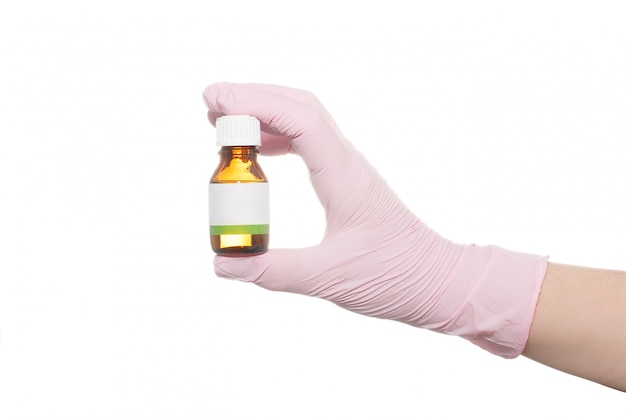 Hand in a pink medical glove on a white background.