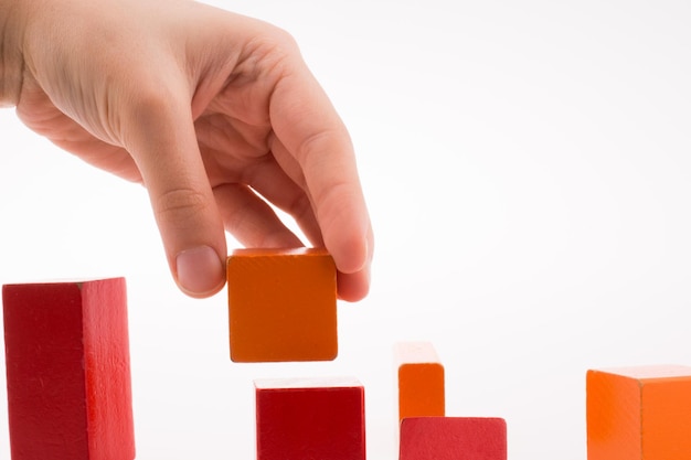 Hand playing with cubes