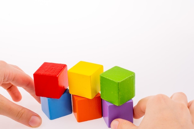 Hand playing with cubes