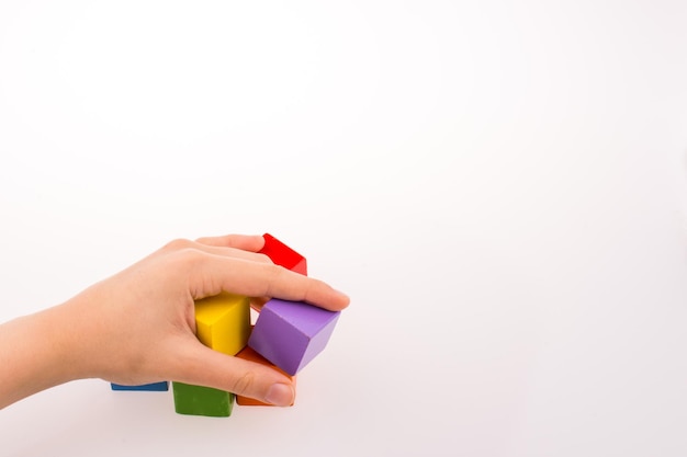 Hand playing with cubes