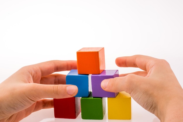 Hand playing with cubes