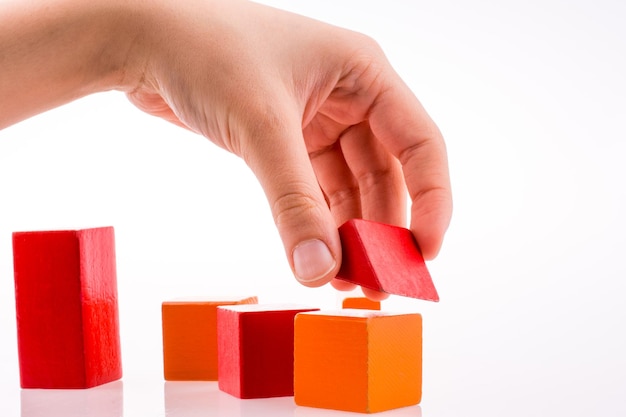 Hand playing with cubes