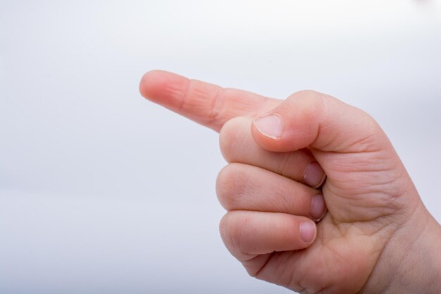 Hand pointing gesture on a white background