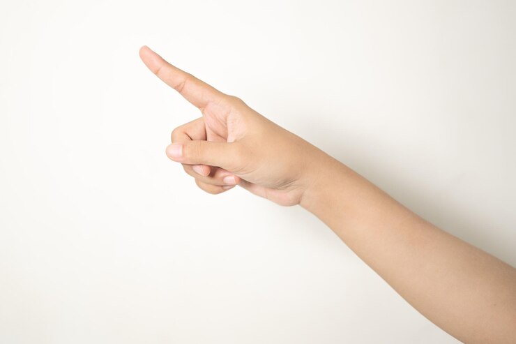 Photo hand pointing at something on white background