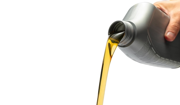 Hand Pouring oil lubricant motor car from a bottle on isolated white background