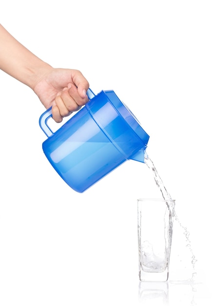 Photo hand pouring water from jug isolated on white background