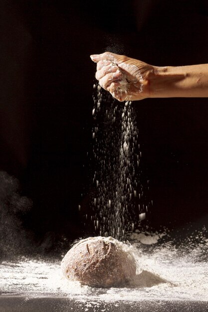 hand pours flour baked bread High quality beautiful photo concept