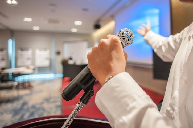 Hand presentation man holding microphone for present something